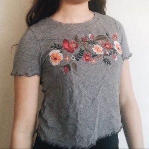 grey shirt with flowers